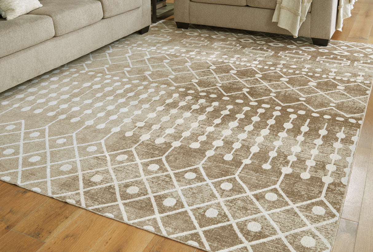 Furniture City Biloxi - Ashley Furniture - Bunchly Rug - 7'10" x 10'3" Washable Rug / Tan/Brown/Cream - R406221
