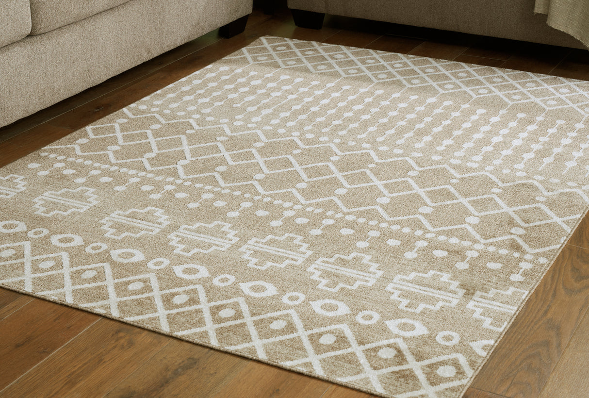 Furniture City Biloxi - Ashley Furniture - Bunchly Rug - 7'10" x 10'3" Washable Rug / Tan/Brown/Cream - R406221