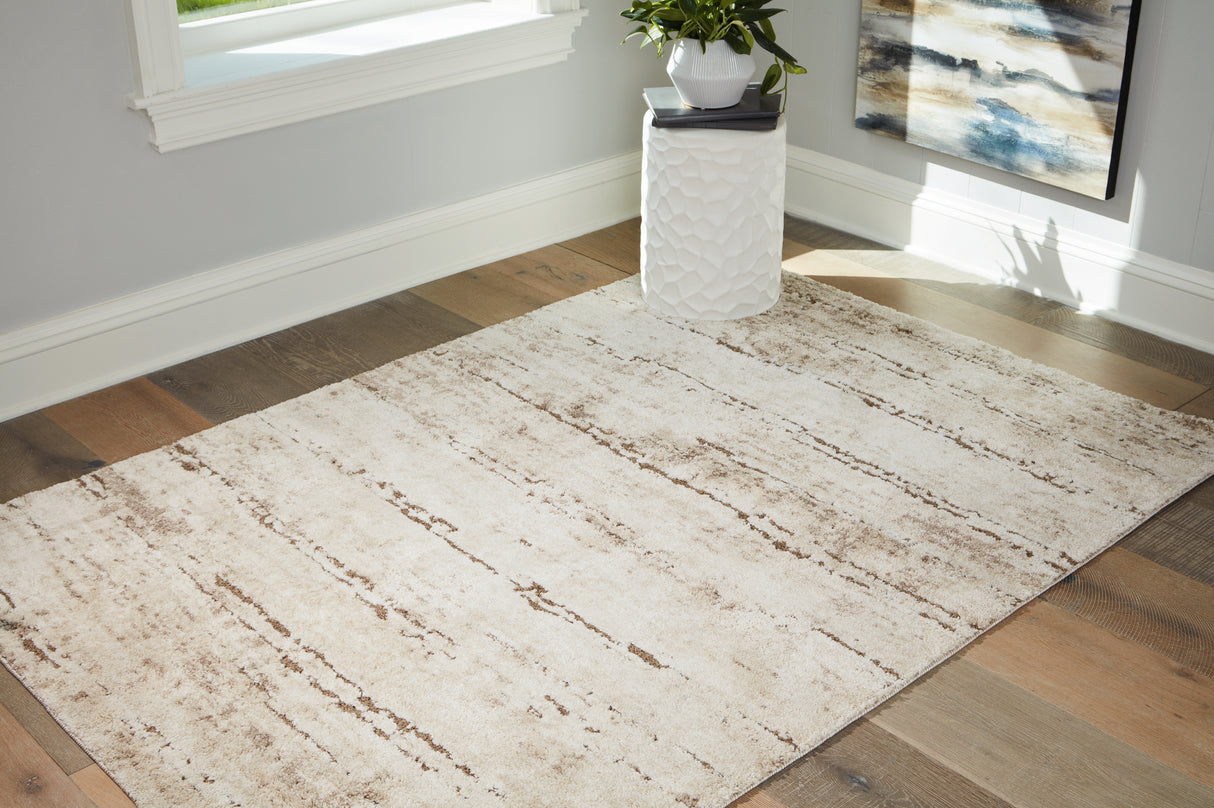 Furniture City Biloxi - Ashley Furniture - Kasney Rug - 5' x 7' Rug / Cream/Brown - R406852