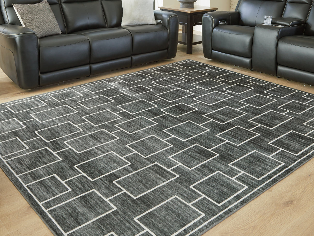Furniture City Biloxi - Ashley Furniture - Elderland Rug - Washable 7'6" x 9'6" Area Rug / Black/Gray - R407401