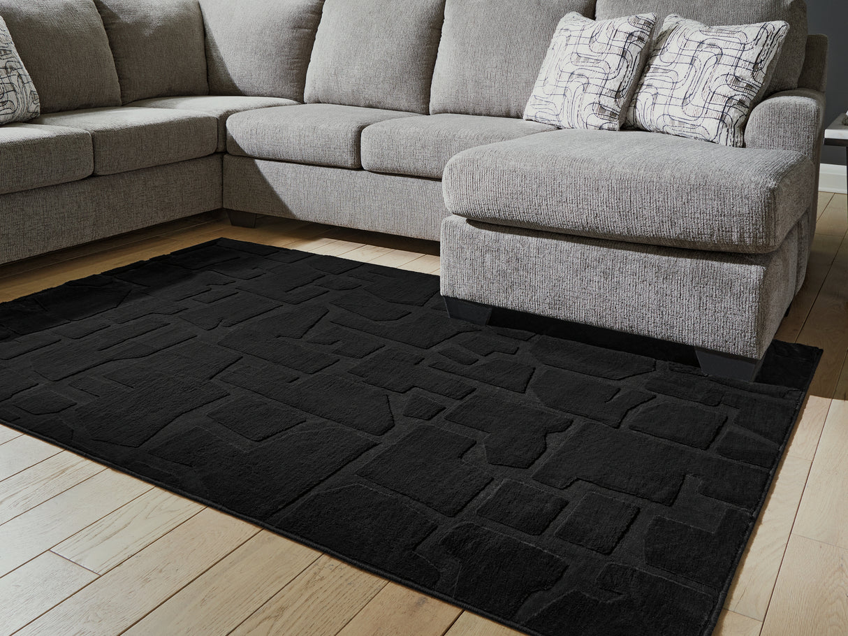 Furniture City Biloxi - Ashley Furniture - Gibbswell Rug - Washable 5' x 7' Area Rug / Black - R407462