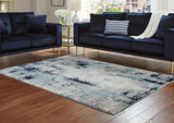 Furniture City Biloxi - Ashley Furniture - Leonelle Rug - 7'10" x 10' Rug / White/Blue/Gray - R404871