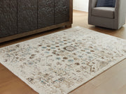 Furniture City Biloxi - Ashley Furniture - Jossler Rug - 5' x 7' Rug / Ivory/Brown/Teal - R407072