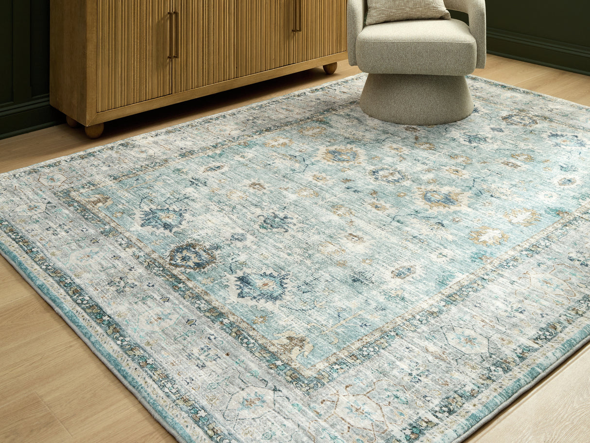 Furniture City Biloxi - Ashley Furniture - Ladstoney Rug - 5' x 7' Area Rug / Teal/Beige/Ochre - R407502