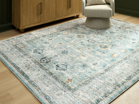 Furniture City Biloxi - Ashley Furniture - Ladstoney Rug - 5' x 7' Area Rug / Teal/Beige/Ochre - R407502