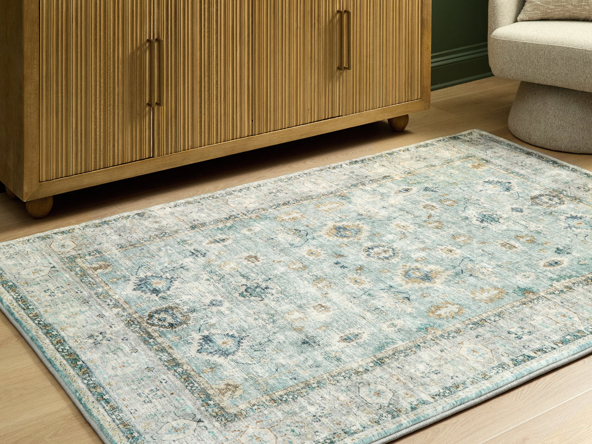 Furniture City Biloxi - Ashley Furniture - Ladstoney Rug - 5' x 7' Area Rug / Teal/Beige/Ochre - R407502