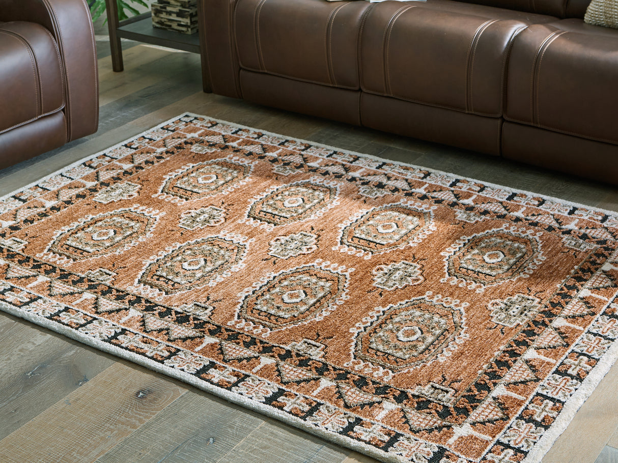 Furniture City Biloxi - Ashley Furniture - Qaabiz Rug - 5' x 7' Area Rug / Sienna/Ivory/Black - R407522
