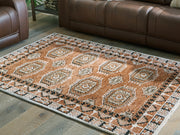 Furniture City Biloxi - Ashley Furniture - Qaabiz Rug - 5' x 7' Area Rug / Sienna/Ivory/Black - R407522