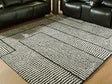 Furniture City Biloxi - Ashley Furniture - Kurtmen Rug - 5' x 7' Area Rug / Black/Ivory - R407592