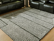 Furniture City Biloxi - Ashley Furniture - Kurtmen Rug - 5' x 7' Area Rug / Black/Ivory - R407592