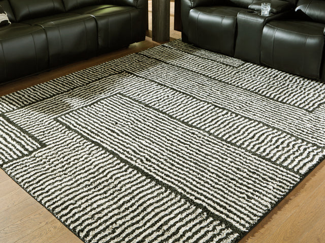 Furniture City Biloxi - Ashley Furniture - Kurtmen Rug - 5' x 7' Area Rug / Black/Ivory - R407592