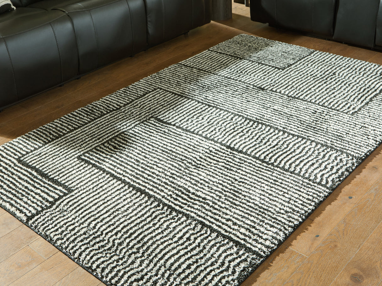 Furniture City Biloxi - Ashley Furniture - Kurtmen Rug - 5' x 7' Area Rug / Black/Ivory - R407592