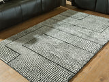 Furniture City Biloxi - Ashley Furniture - Kurtmen Rug - 5' x 7' Area Rug / Black/Ivory - R407592