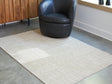 Furniture City Biloxi - Ashley Furniture - Wolbert Rug - 5' x 7' Area Rug / Tan/Ivory - R407662